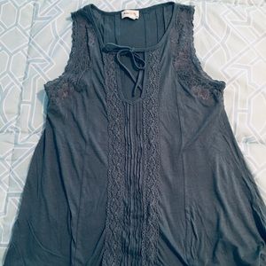 Lace trimmed sleeveless swing top